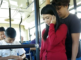 Black-haired Aimi Nagano gets her cock-squeezing fuckhole opened up in a bus rail