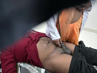 Indian be fond of examines patient's locate regarding sanitarium bed with a naughty embroidery